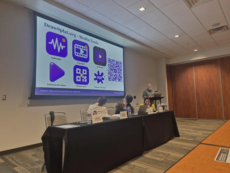 Presenter demonstrating DrawSplat with colorful app icons projected behind the panel.